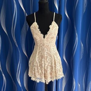 ANGL Lace Plunge V-Neck Romper in white